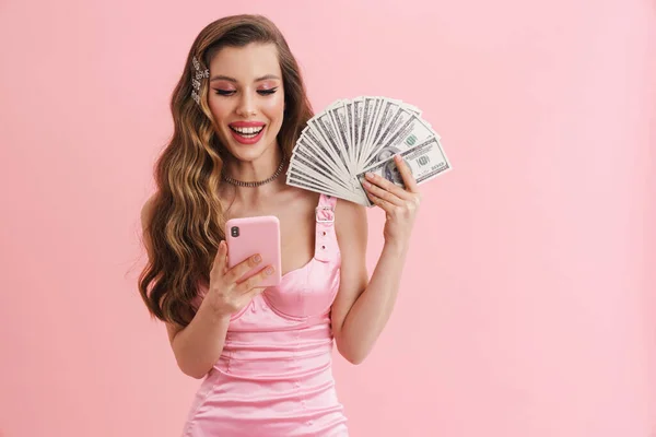 Young Smiling Woman Posing Dollars Mobile Phone Isolated Pink Background — Stock Photo, Image