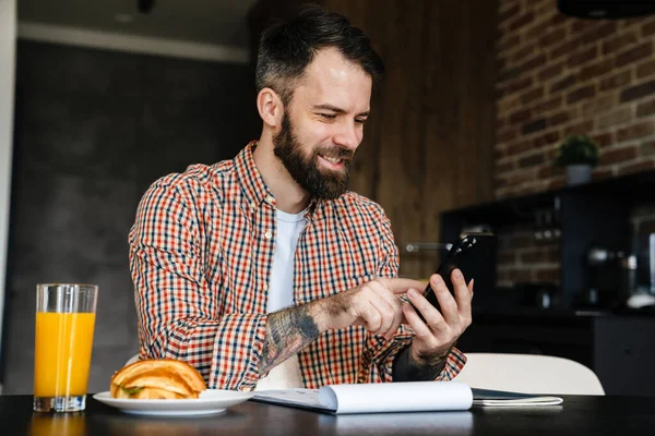 Smiling Mid Aged Brunette Man Holding Mobile Phone Working Documents — Stock Photo, Image