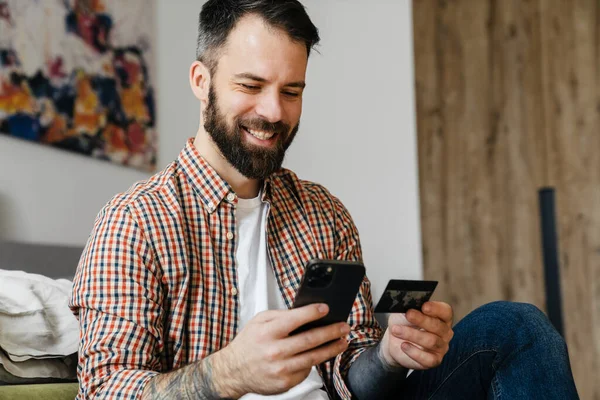 Smiling Mid Aged Brunette Bearded Man Holding Mobile Phone Sitting — Stock Photo, Image