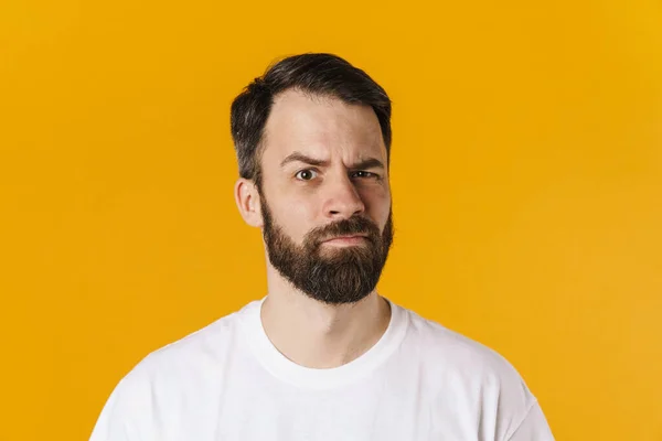 Portrait Confused Brunette Bearded Man Standing Looking Camera Yellow Wall — 스톡 사진