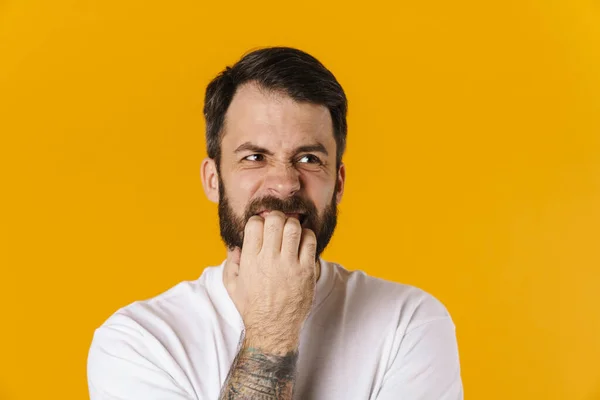 Portrait Concerned Brunette Bearded Man Yellow Background Biting Nails — Photo