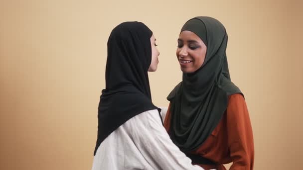 Happy Arabian Woman Wearing National Hijab Hugging Her Friend Standing — Stock Video