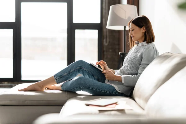 Smiling Middle Aged Woman Using Digital Tablet While Relaxing Couch — 스톡 사진