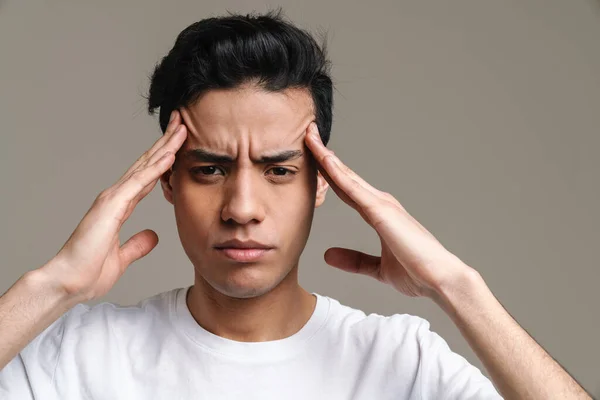 Brunette Hispanic Man Headache Frowning Rubbing His Temples Isolated Grey — Stock Photo, Image