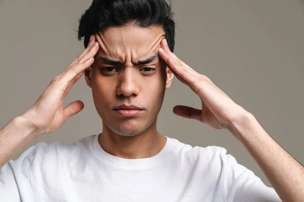 Brunette Hispanic Man Headache Frowning Rubbing His Temples Isolated Grey — Stock Photo, Image