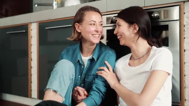 Happy Lgbt Couple Girls Sitting Floor Together Kitchen — Stock Video