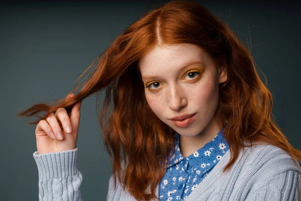 Young Ginger Woman Looking Camera Holding Strand Her Hair Isolated — Stock Photo, Image