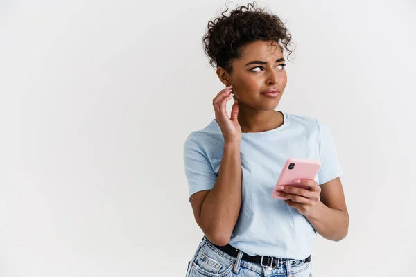 Black Puzzled Woman Shirt Using Mobile Phone Isolated White Background — Fotografia de Stock