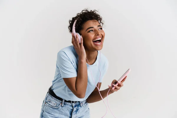 Laughing Black Woman Listening Music Headphones Cellphone Isolated White Background —  Fotos de Stock