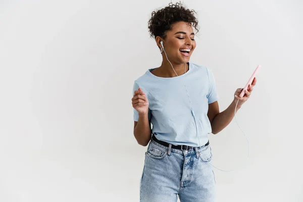 Laughing Black Woman Listening Music Headphones Cellphone Isolated White Background — Φωτογραφία Αρχείου