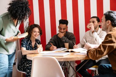 Mixed-race group shares ideas creative thoughts with multi-ethnic mates, teamwork leadership concept