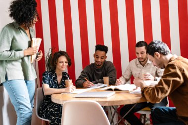 Mixed-race group shares ideas creative thoughts with multi-ethnic mates, teamwork leadership concept