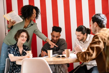 Mixed-race group shares ideas creative thoughts with multi-ethnic mates, teamwork leadership concept