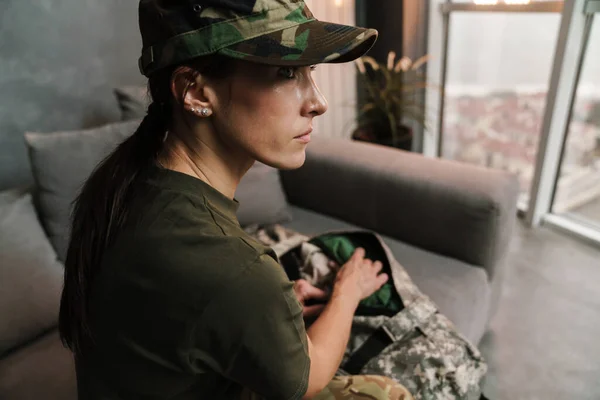 Serious Beautiful Soldier Woman Sitting Sofa Bag Indoors — Stock Photo, Image