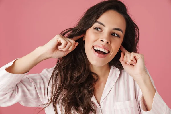 Cheerful Beautiful Woman Smiling While Plugging Her Ears Isolated Pink — Stock Photo, Image