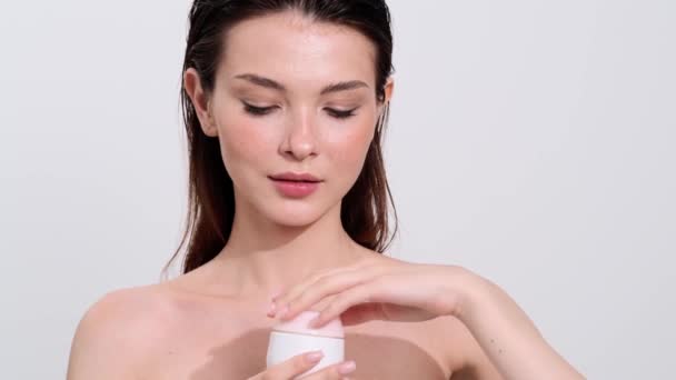 Pleased Half Naked Brunette Woman Holding Cream Standing White Background — Stock Video