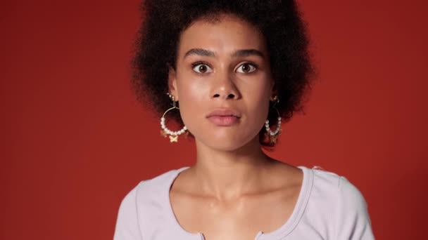 Scared African American Woman Looking Camera Standing Isolated Red Wall — Stock Video