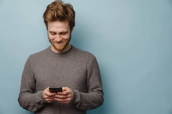 White Ginger Man Beard Smiling Using Mobile Phone Isolated Blue — Stock Photo, Image