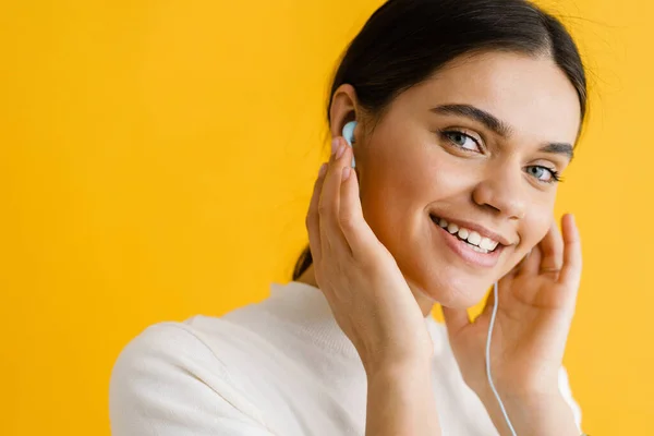 Young Smiling Woman Listening Music Earphones Isolated Yellow Background — Stock Photo, Image