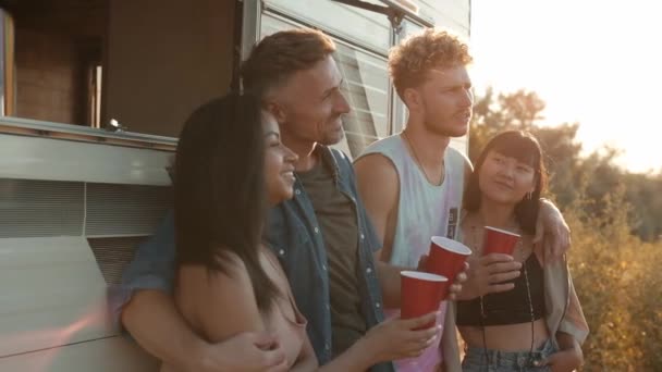 Happy Friends Drinking Cocktails Standing Modern Caravan Trailer While Traveling — Stok Video
