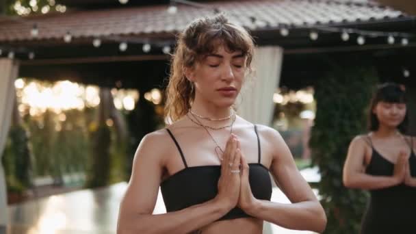 Beautiful Woman Doing Yoga While Holding Hands Praying Gesture — Stock Video