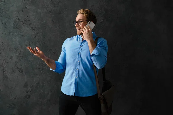 Smiling Man Blue Shirt Glasses Talking Phone While Standing Bag — Stock Photo, Image