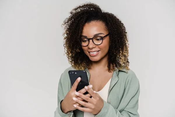 Smiling Woman Holding Phone Her Hands Looking His Screen While — Stock Photo, Image
