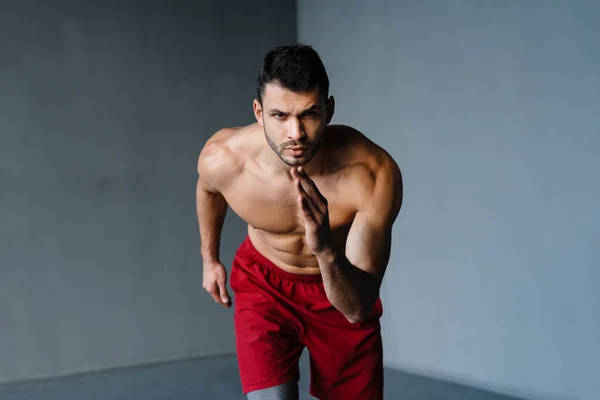 Young Shirtless Sportsman Doing Exercise While Working Out Indoors — Stock Photo, Image