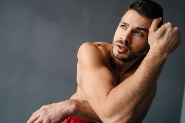 Young Shirtless Sportsman Looking Aside While Working Out Indoors — Stock Photo, Image