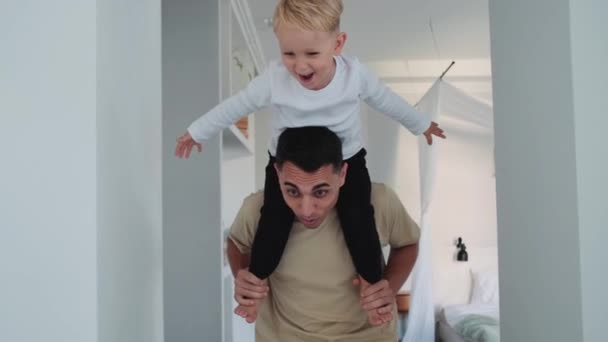 Father Carrying His Small Son His Shoulders Home — Stock Video