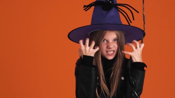 Emotional Small Girl Witch Costume Show Frightening Emotions Standing Isolated — Stock Video