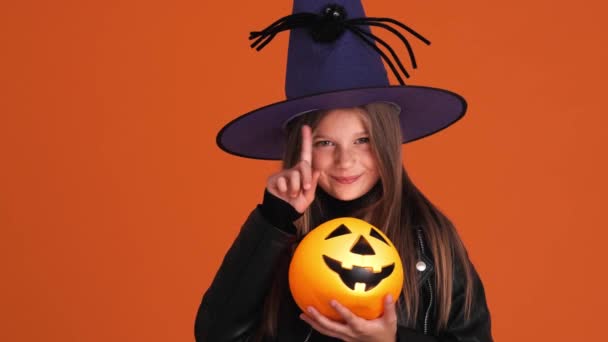 Cunning Small Girl Witch Costume Shaking Her Finger While Holding — Stock Video
