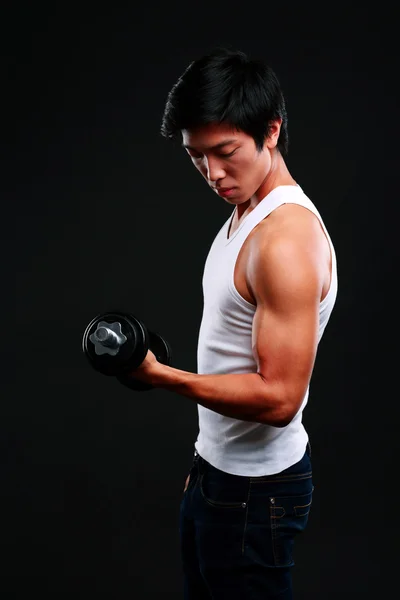 Handsome fit asian man isolated on black background — Stock Photo, Image