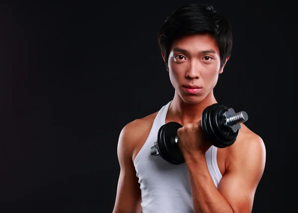 Handsome fit asian man isolated on black background — Stock Photo, Image