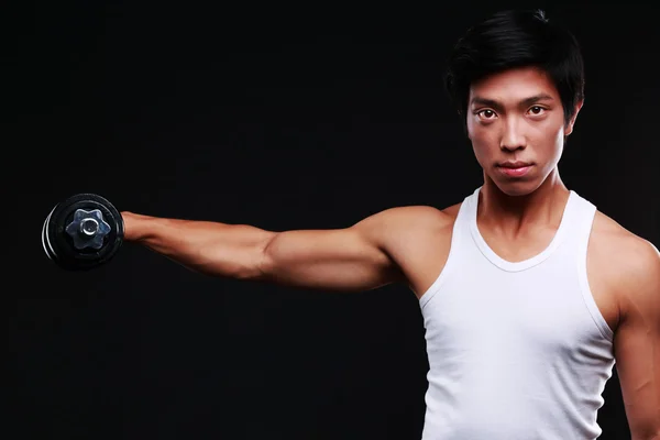 Handsome fit asian man isolated on black background — Stock Photo, Image