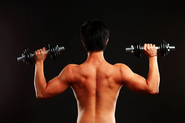 Guapo asiático hombre aislado en negro fondo — Foto de Stock