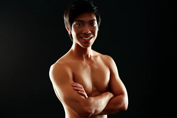 Handsome asian man isolated on black background — Stock Photo, Image