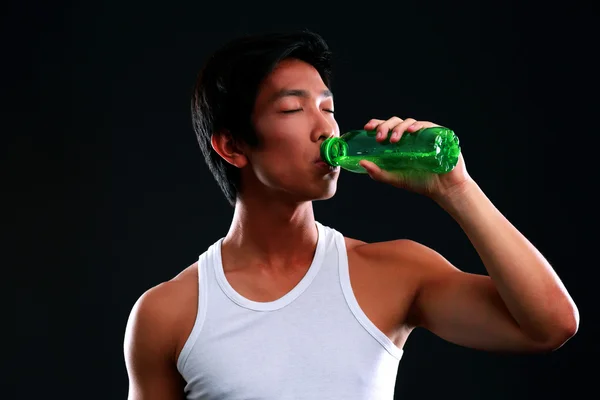 Handsome asian man isolated on black background — Stock Photo, Image