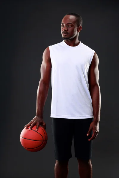 Handsome sports african man over black background — Stock Photo, Image