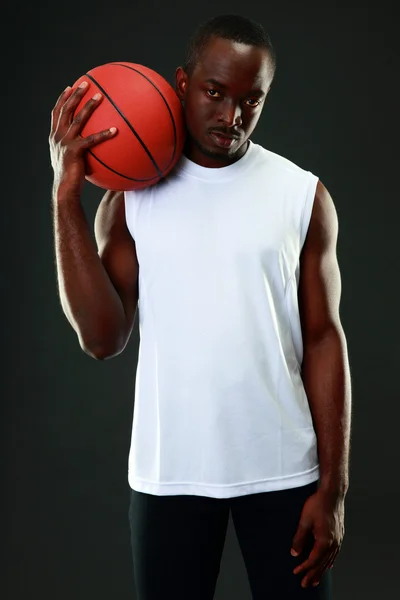 Handsome sports african man over black background — Stock Photo, Image