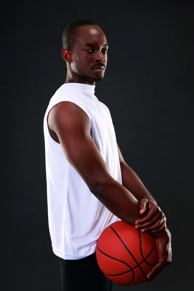 Handsome sports african man over black background — Stock Photo, Image