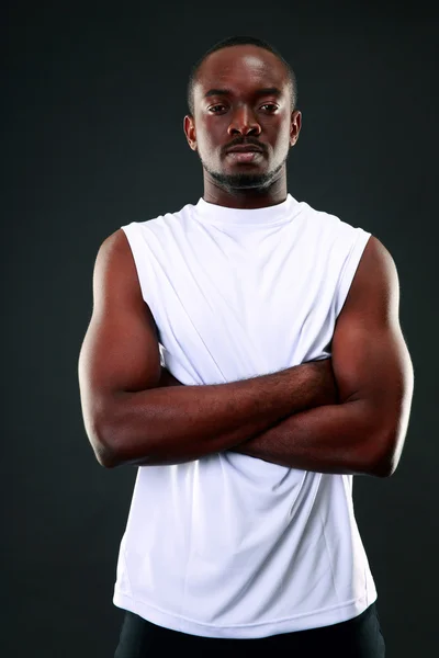 Handsome sports african man over black background — Stock Photo, Image