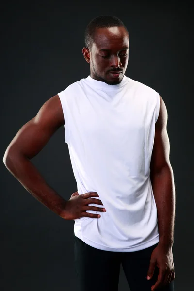 Handsome sports african man over black background — Stock Photo, Image