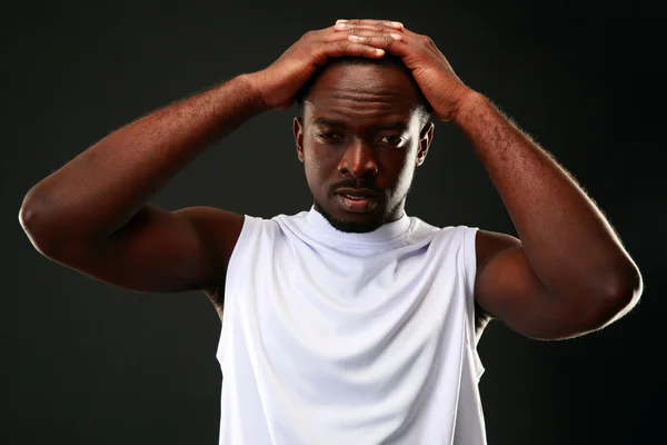 Handsome sports african man over black background — Stock Photo, Image