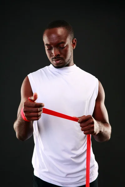 Handsome sports african man over black background — Stock Photo, Image