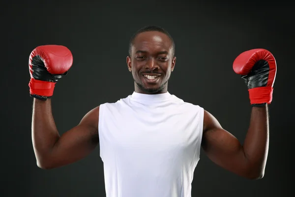 Handsome sports african man over black background — Stock Photo, Image