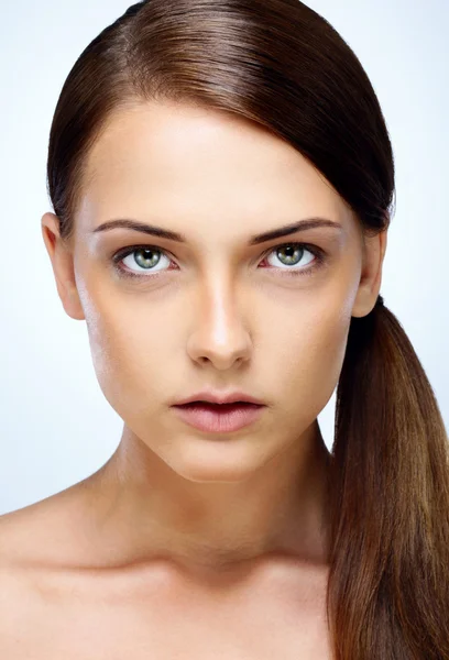 Young beautiful woman isolated on blue background — Stock Photo, Image