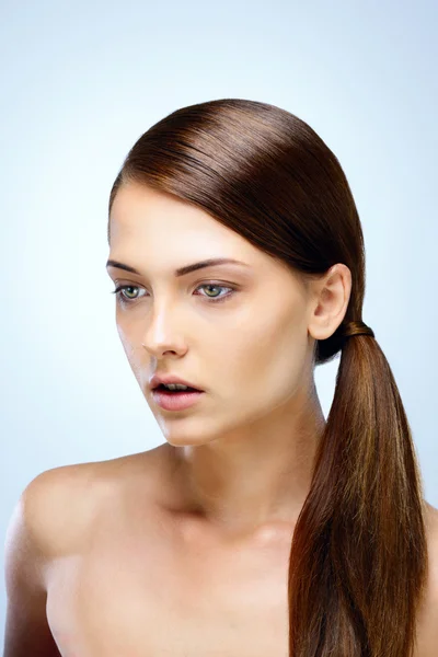 Young beautiful woman isolated on blue background — Stock Photo, Image