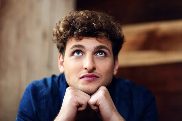 Handsome man with curly hair — Stock Photo, Image