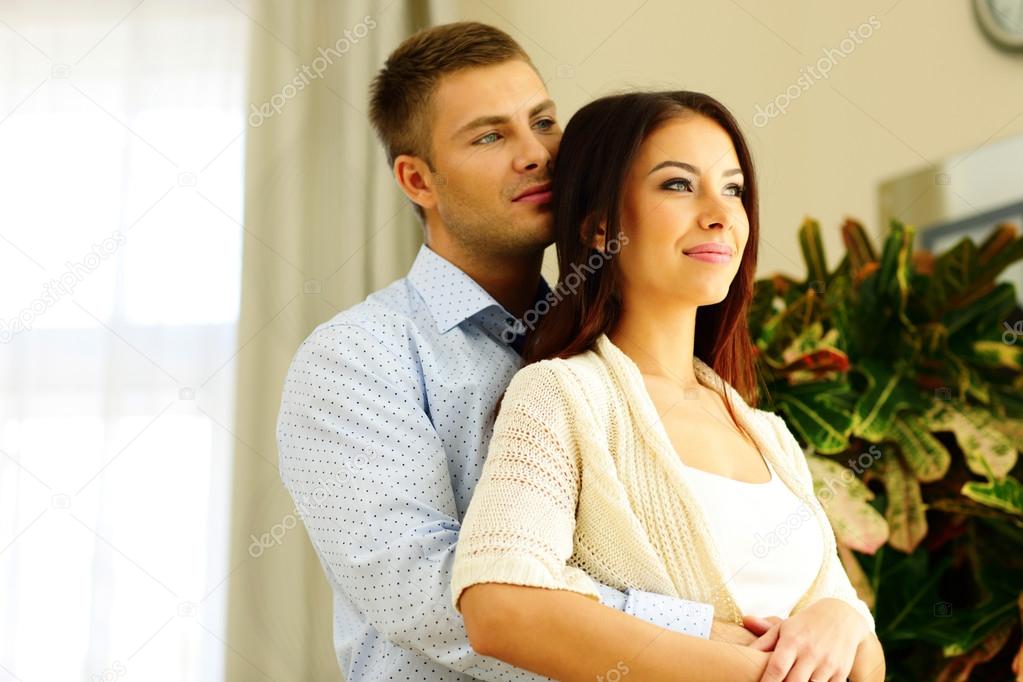 Portrait of a young beautiful couple at home